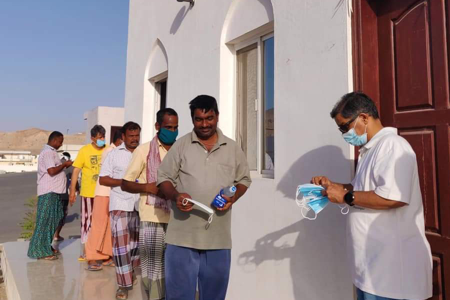 Volunteers of the Muscat Centre conduct a food and essentials distribution drive to support daily wage earners